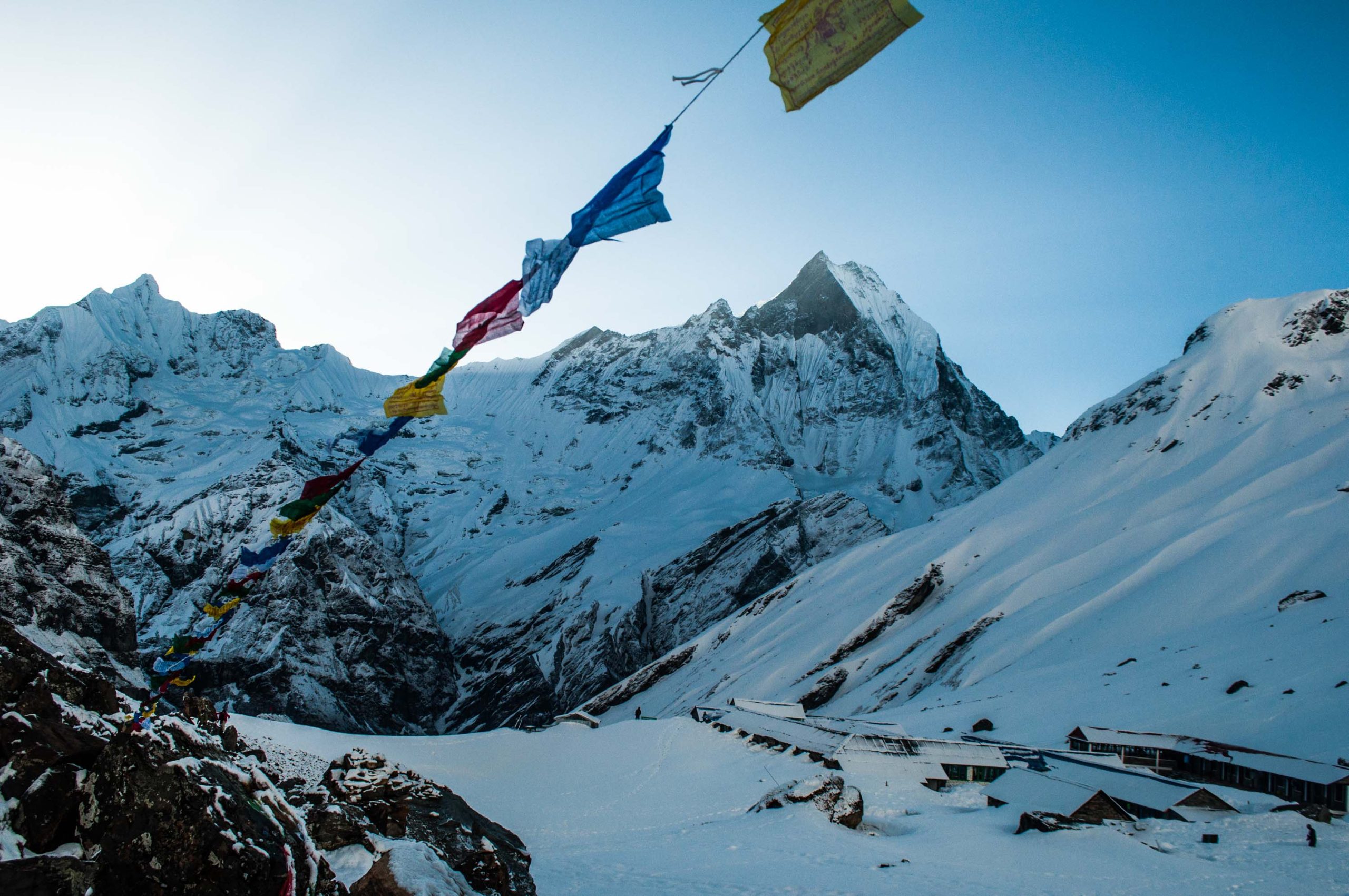 a flag on a string in the snow - Annapurna Base Camp trek - a most popular trekking trail of nepal 